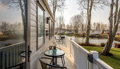 photo of caravan decking next to a pond