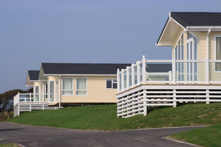 investing in a static caravan three holiday homes with verandas on a holiday park