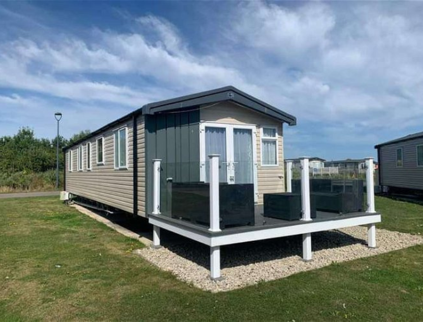 Static caravan at Primrose Valley with a private deck, perfect for family stays at caravan holiday parks with indoor pools.