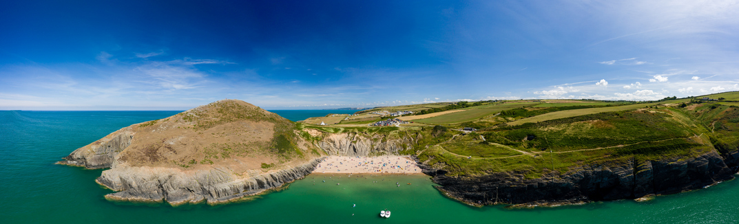Panoramic aerial view of a beautiful sandy beach and headland (Mwnt, Ceredigion, West Wales)